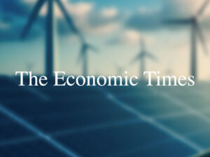 The Economic Times logon over a blurred photo of renewable energies