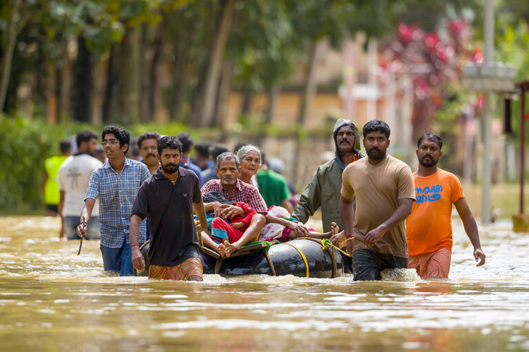 Rescue team help people from flooded area