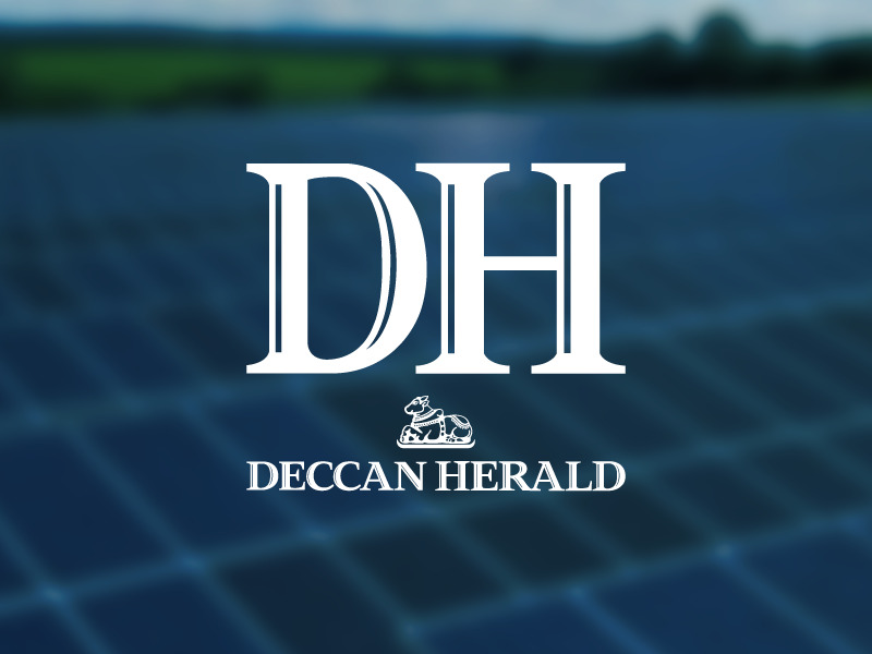 Deccan Herald logo over a blurred photo os photo voltaic planes